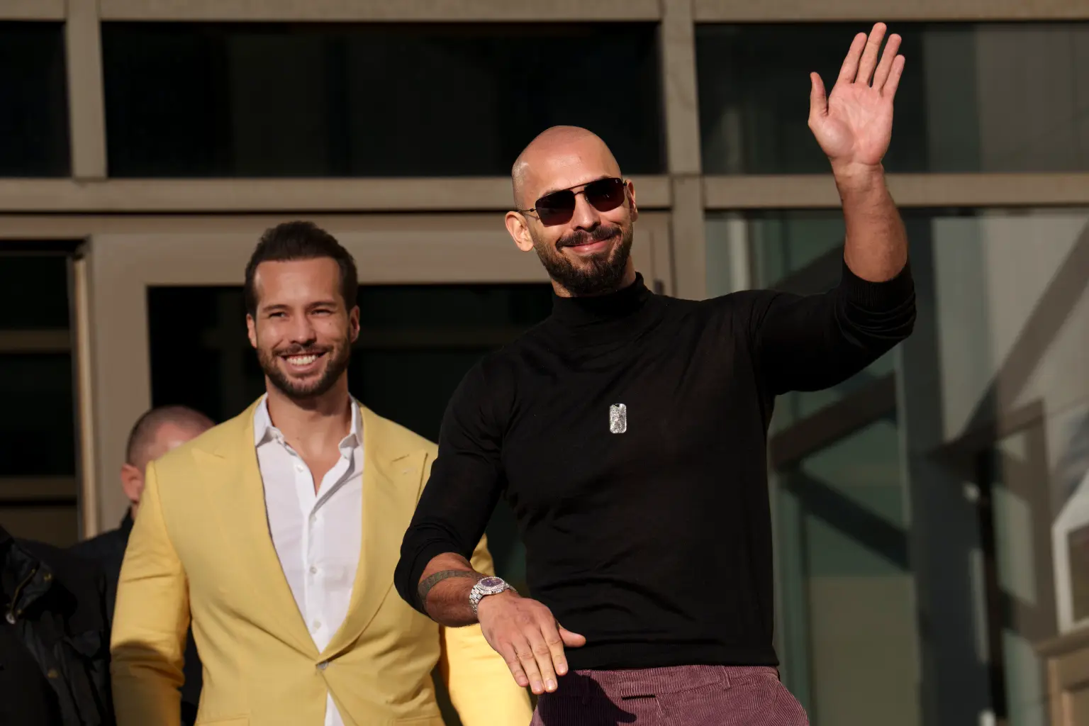 Andrew Tate Waves Defiantly After Bucharest Tribunal Appearance A Andrew Tate Waves Defiantly After Bucharest Tribunal Appearance A